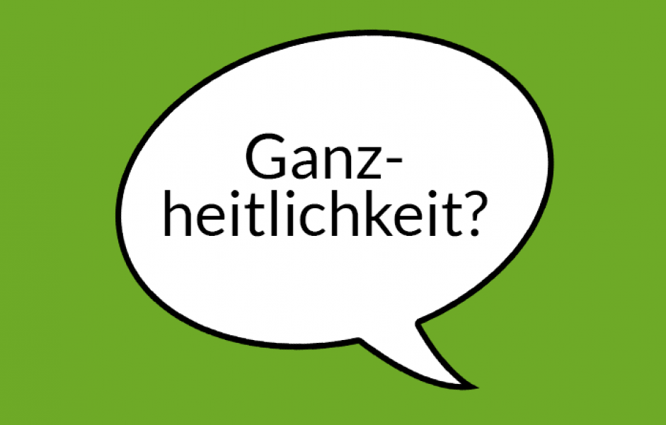 Weiße Sprechblase auf hellgrünem Grund mit Aufschrift "Ganzheitlichkeit"
